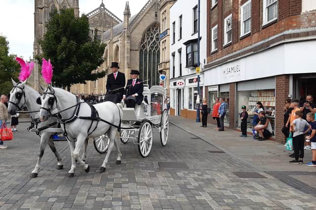 The funeral procession makes its way from St Botolph's Church following the service.