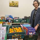 Manager of the food bank Jonny Whelbourn with some of the advent calendars donated by Butlin’s.