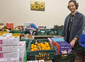 Manager of the food bank Jonny Whelbourn with some of the advent calendars donated by Butlin’s.