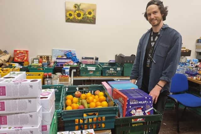 Manager of the food bank Jonny Whelbourn with some of the advent calendars donated by Butlin’s.