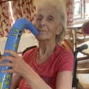 This Tanglewood resident joins in the fun of the festival by playing a plastic saxophone.
