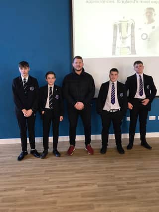 Former England Rugby Captain Dylan Hartley with students