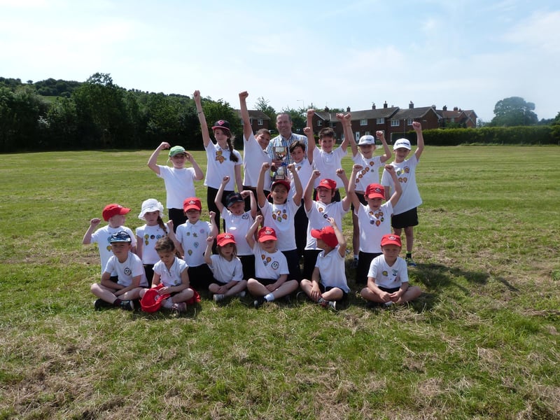 The Kestrels team at Nettleton Primary School's sports day of 2014. Members are pictured alongside chairman of governors Simon Carey, proudly holding aloft the winner’s trophy.