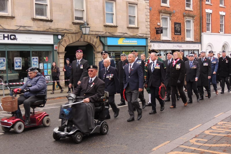 Veterans and Royal British Legion members march to the Market Place.
