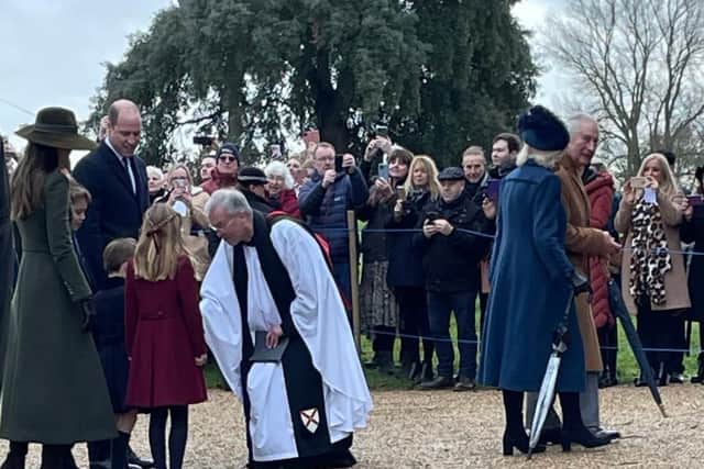 Reverend Canon Dr Paul Rhys Williams greets the Prince and Princess of Wales and Prince George, Princess Charlotte and Prince Louis.