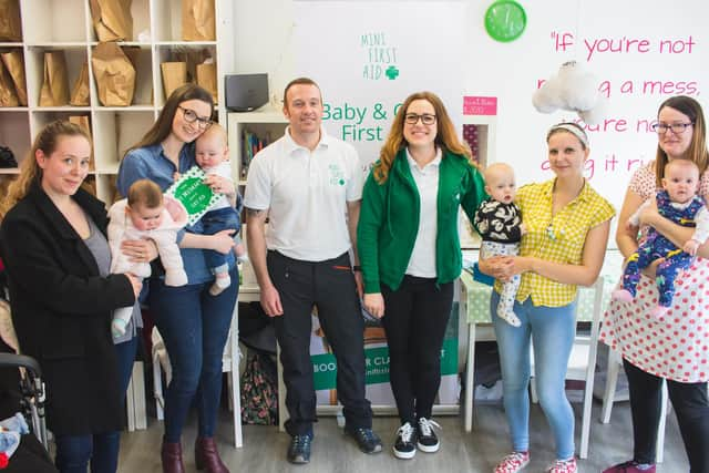 James and Zoe Reddin, centre, teach First Aid to children and parents