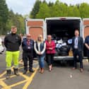 National Highways staff and suppliers with some of the donations collected for the air ambulance charities