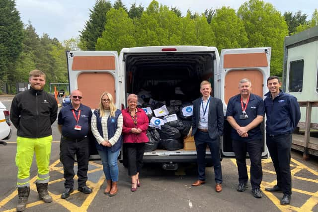 National Highways staff and suppliers with some of the donations collected for the air ambulance charities