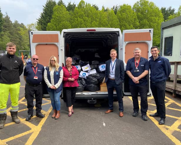 National Highways staff and suppliers with some of the donations collected for the air ambulance charities