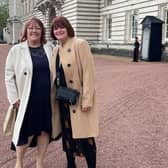 Susan and Carolyn outside Buckingham Palace