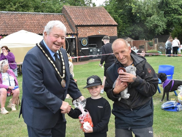 Mayor of Skegness Coun Pete Barry congratulating a winner.