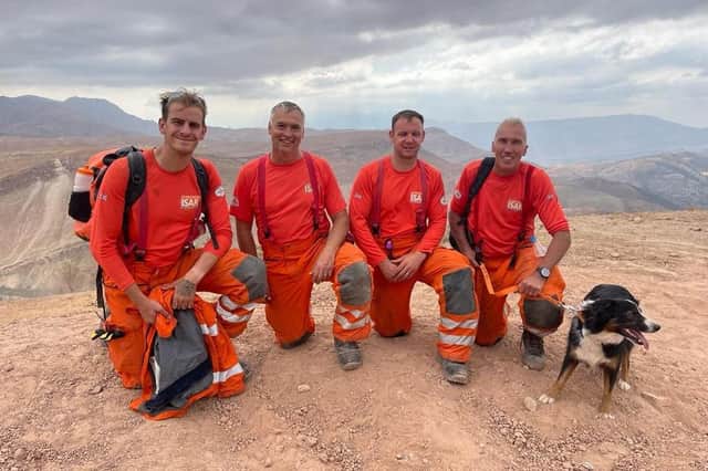 Taking a moment from the search and rescue work in the Atlas Mountains of Morocco. (L-R) Ben Clarke, Darren Burchnall, Karl Keuneke and Neil Woodmansey with Colin the rescue dog.