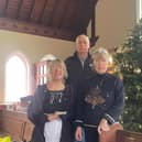 Pastor Susan Alldread (right) with the Dobbies' donation for the Wainfleet Methodist Church Christmas Tree Festival and community meal.