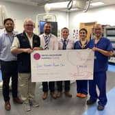 Alan Pearce presenting a cheque to Professor Kelvin Lee and other colleagues from United Lincolnshire Hospitals NHS Trust.