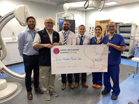 Alan Pearce presenting a cheque to Professor Kelvin Lee and other colleagues from United Lincolnshire Hospitals NHS Trust.