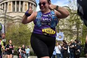 Laura will run at least 10k every month