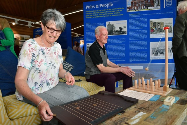 Wendy and Steve Renshaw enjoying a traditional pub game at the Inns on the Edge exhibition. . Steve is secretary of the Lincoln branch of CAMRA