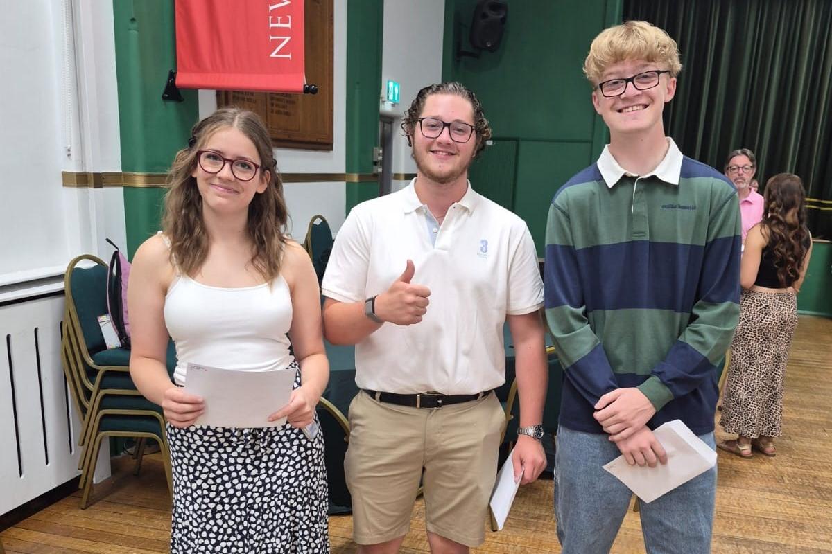 Isabel, Oscar, Alfie collect their results.