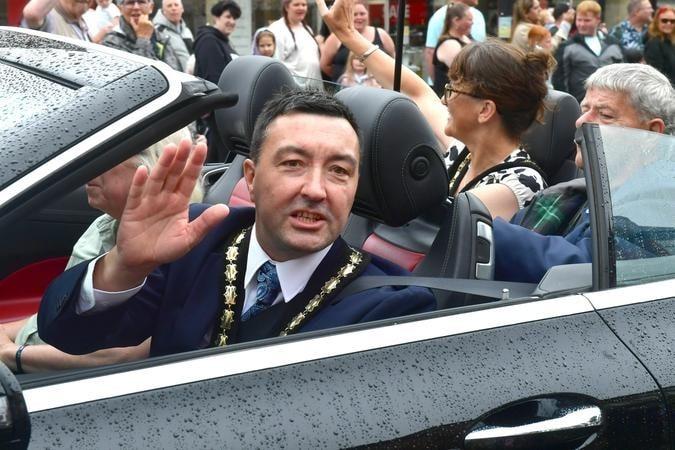 Mayor of Skegness Coun Jimmy Brookes waving to the crowd.