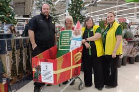 Colleague from Asda Boston with the special donations trolley