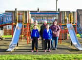 Senior community action officer, Shayleen Towns, Coun Paul Howitt-Howan, volunteer Tracy Williams and children from Hemswell Cliff Primary School