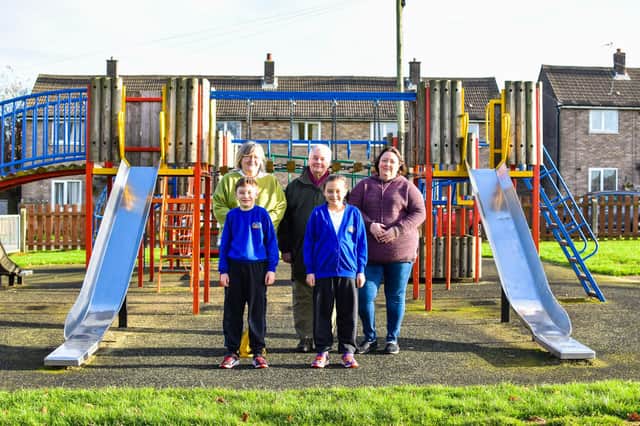 Senior community action officer, Shayleen Towns, Coun Paul Howitt-Howan, volunteer Tracy Williams and children from Hemswell Cliff Primary School