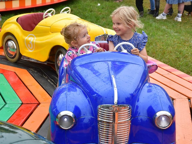 Penny Frain-Hope 1 and Matilda Frain-Hope 4 of Denmark on the funfair rides at Heckington Show. Photos: David Dawson