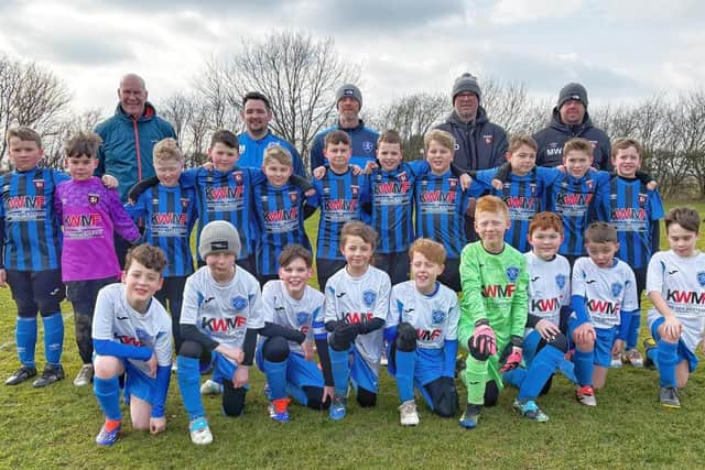 Young teams from Louth Football Club and Fulstow Juniors under-tens in their new kits, sponsored by the Ken Westerby Memorial Fund (KWM).