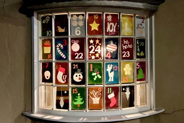 An Advent calendar windows at F H Manning Finacial Services.