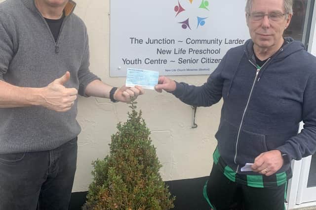 Chairman of sleaford Snails Walking Football Club handing over Cheque to New Life Foodbank