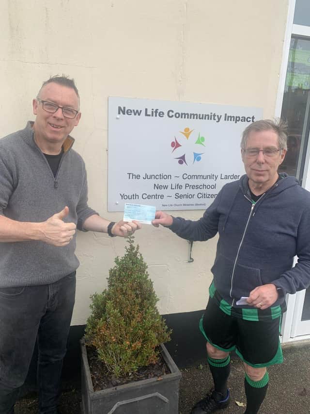 Chairman of sleaford Snails Walking Football Club handing over Cheque to New Life Foodbank