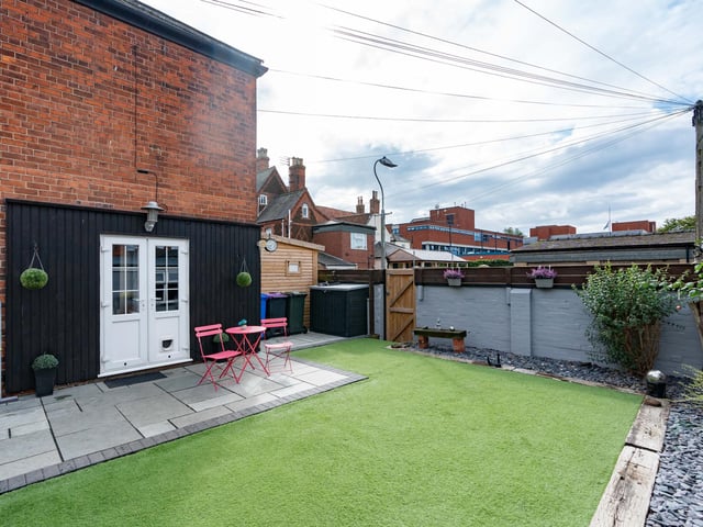 The area outside leading from the kitchen/diner.