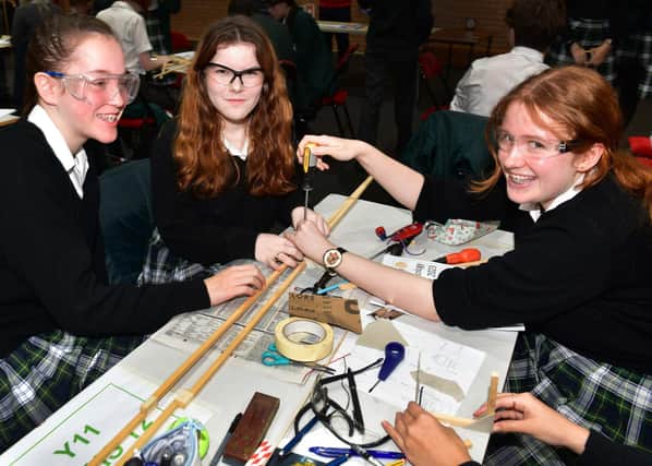 From left -  Emily,  Chira and Rosie of KSHS taking part in the STEM challenge. Photo: Mick Fox