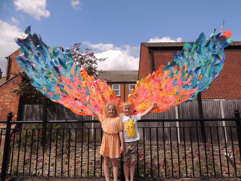 Bethany and Luke Gow, both seven, try selfie wings at Riverside Precinct.