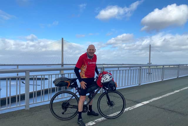 Misterton firefighter Steve Beevers crossing the Forth Bridge in Scotland during his Land's End to John O'Groats charity ride.