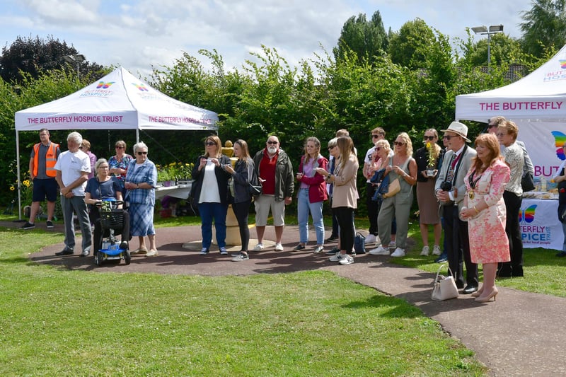 People gathered at the hospice grounds for the service and butterfly release.