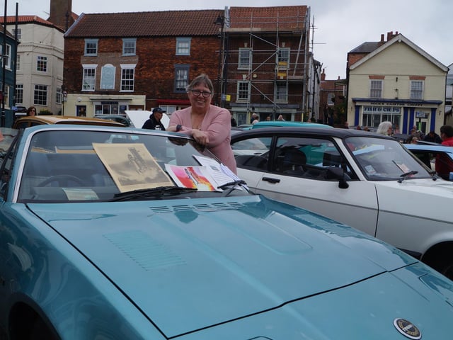 Christine Robinson with her husband's Triumph TR7 - one of the last of its type made.