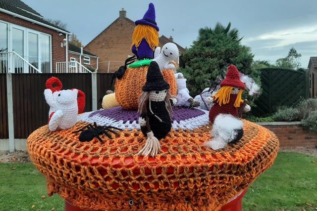 A Halloween scene complete with witches, ghosts, pumpkins, gravestones and spiders.