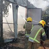 Firefighters at the scene of the workshop blaze at the Bubblecar Museum, Langrick. Picture: Paula Ashleigh-Morris