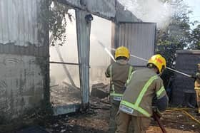 Firefighters at the scene of the workshop blaze at the Bubblecar Museum, Langrick. Picture: Paula Ashleigh-Morris
