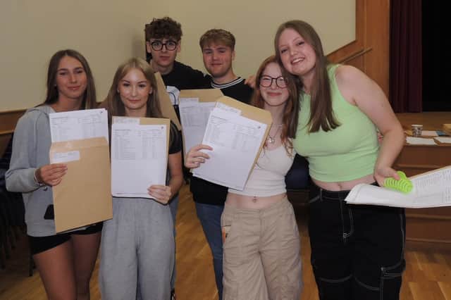 Celebrations on GCSE results day at St George's Academy. From left - Keira Woollaston, Libby Gallett, Will Draper, Alex Langford, Gracie Greensmith and Rhiannon Clarkson.