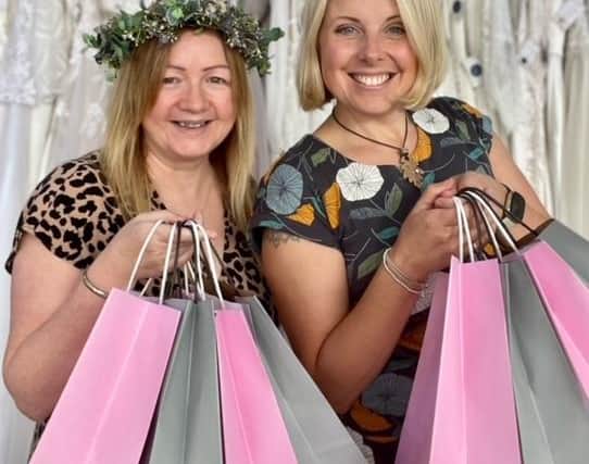 Clare Bradford with Alison Riley of Bridal Reloved Caistor with the goodie bags available to the first 30 brides.