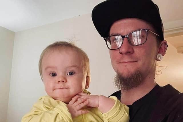 Adi Whiting with his baby son Sylvester.