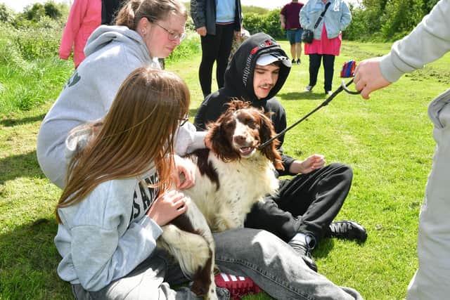 Zoe Brophy and Joshua Brophy meet one of the therapy dogs at the taster event in Sotby. (PHOTO BY: D.R. Dawson Photography)