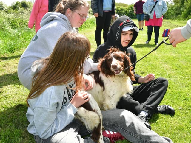 Zoe Brophy and Joshua Brophy meet one of the therapy dogs at the taster event in Sotby. (PHOTO BY: D.R. Dawson Photography)