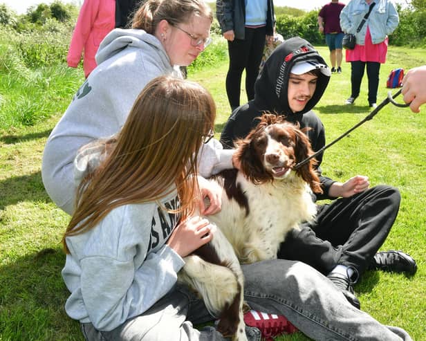 Zoe Brophy and Joshua Brophy meet one of the therapy dogs at the taster event in Sotby. (PHOTO BY: D.R. Dawson Photography)