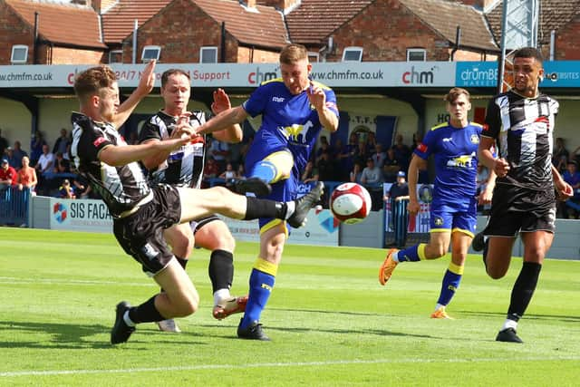 Gainsborough Trinity's Andrew Wright is tackled by Stafford Rangers' Joseph Dunne. Picture by Dan Westwell