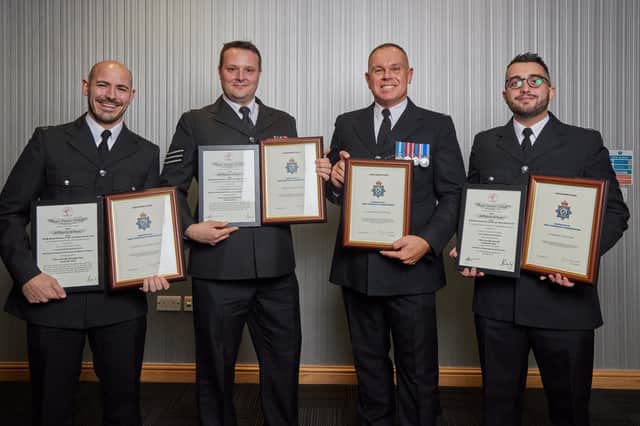 PCs Christopher Hine, David Sharpe and Jack Craft and Sergeant Simon Watson and with their awards.