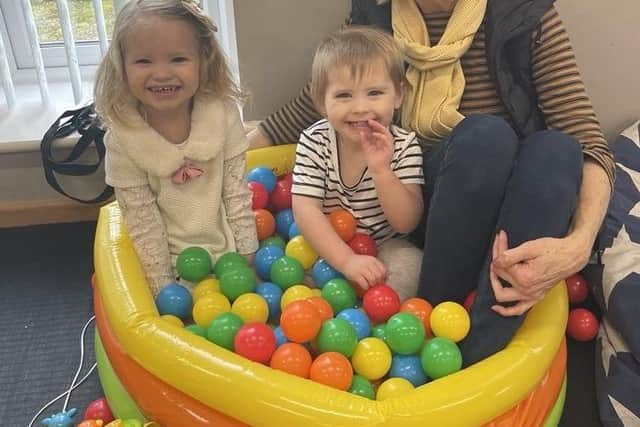 Aaliyah Murphy-Ives, Peyton Sargeant, and volunteer toddler leader, Ann Scarboro of Munchkins.