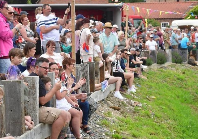 Crowds lined the banks to cheer on the crowds.